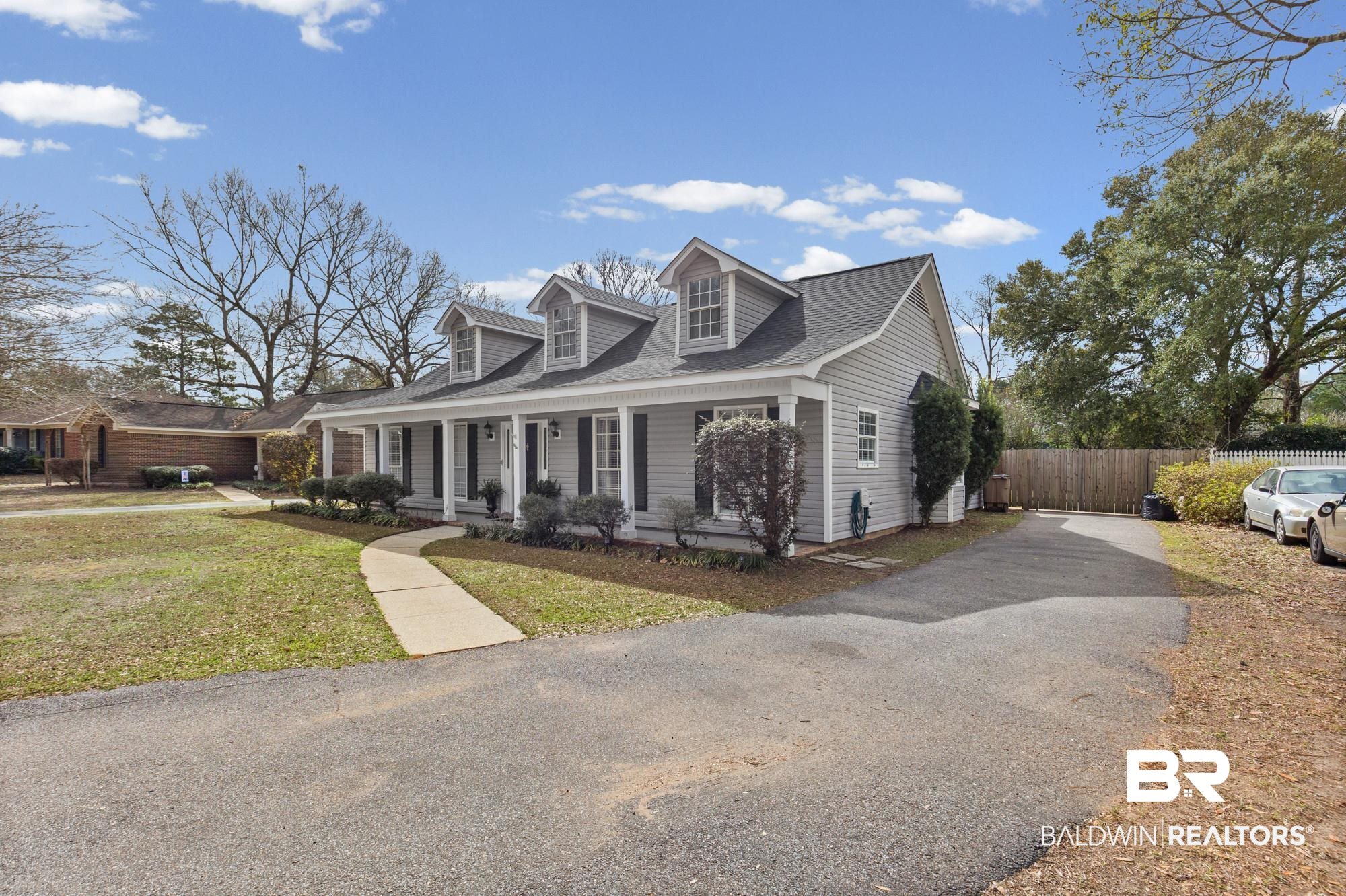 6609 Blakeley Court Mobile, AL 36695 - Photo 27 of 28 Cape cod house featuring covered porch, asphalt driveway, and a shingled roof