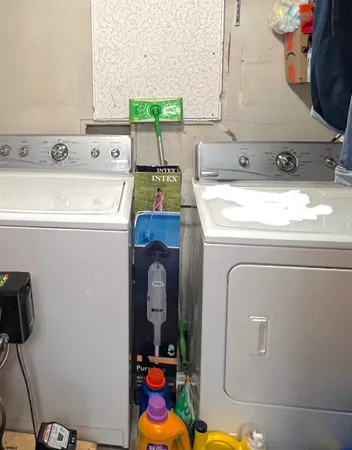 a utility room with dryer and washer
