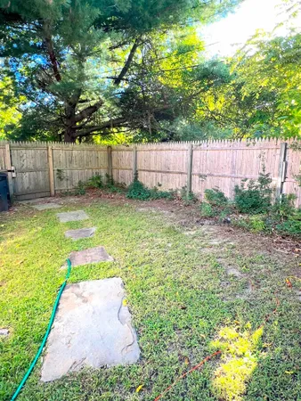 a view of a yard with a small cabin