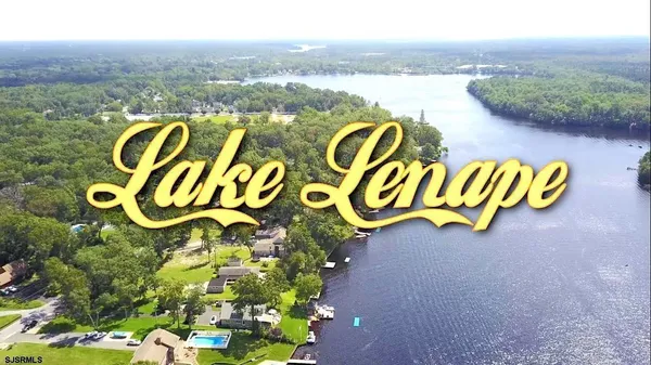 a sign that is sitting in the middle of a lake