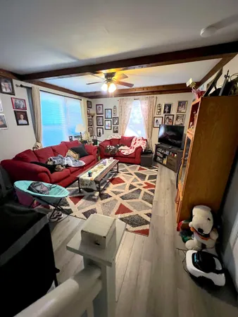 a bed room with furniture and a window