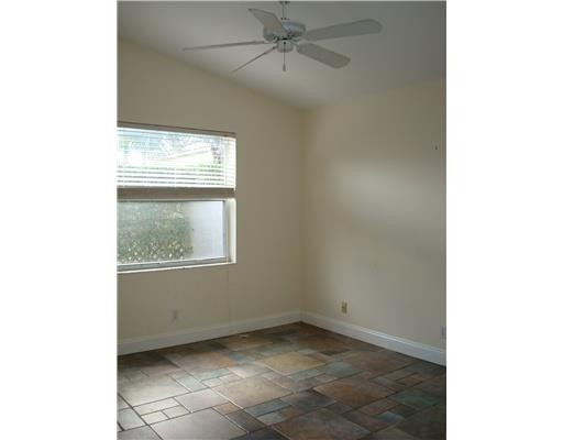 11030 Baybreeze Way Boca Raton, FL 33428 - Photo 6 of 11 a view of an empty room with a window
