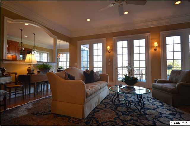 3072 Darby Road, Unit P2A 31 Keswick, VA 22947 - Photo 8 of 40 Soothing diffused light filters through the large french windows imbuing the space with a restful ambiance that lulls you into a timeless state. Built-ins flank the windows & provide a stage for your treasures to shine.