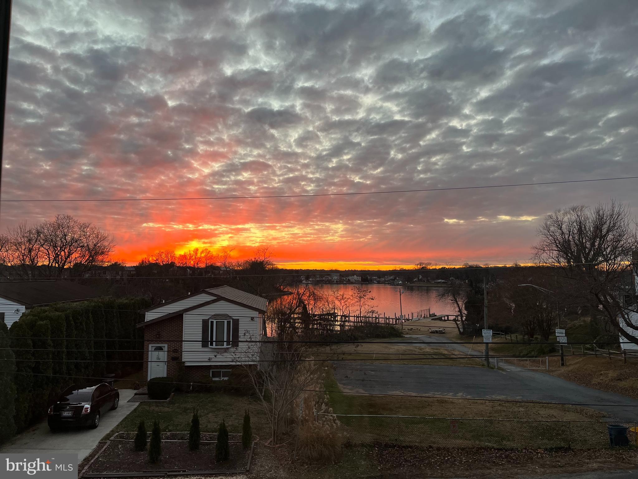 8418 Geneva Road Pasadena, MD 21122 - Photo 53 of 53 Sunset from Upper-Level Living Room