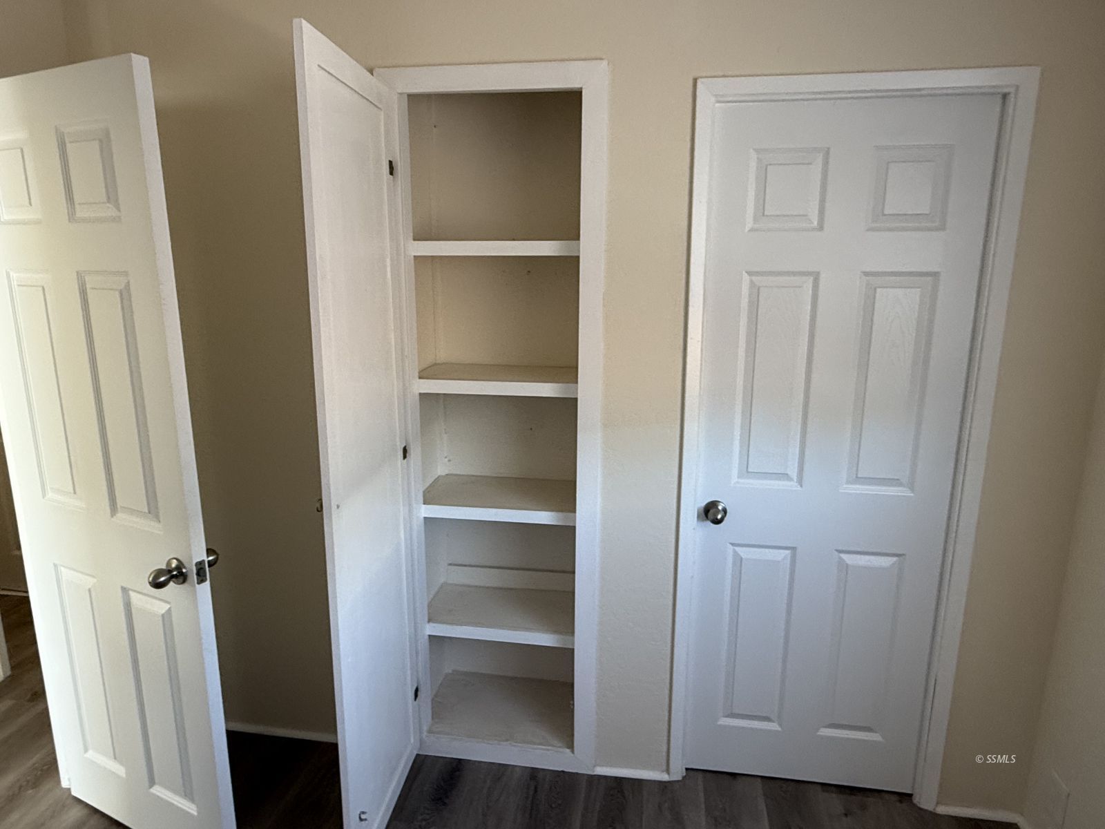 1345 West Upjohn Avenue Ridgecrest, CA 93555 - Photo 6 of 9 a view of walk in closet with empty racks