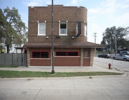 6021 South Archer Road Summit, IL 60501 - Photo 2 of 3 a house that has a tree in front of it