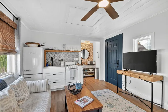 a room with furniture and a flat screen tv