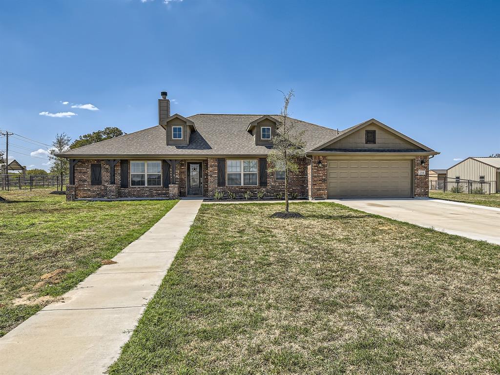254 Springwood Ranch Loop Springtown, TX 76082 - Photo 1 of 1 a front view of a house with a yard