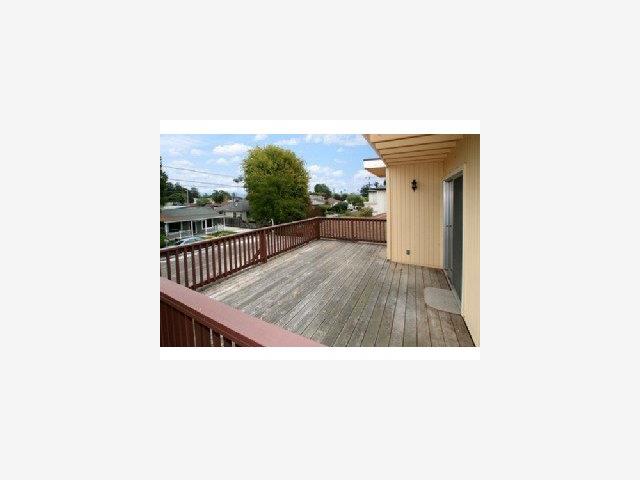 4550 Opal Street Capitola, CA 95010 - Photo 6 of 8 a picture of a room with a floor to ceiling window