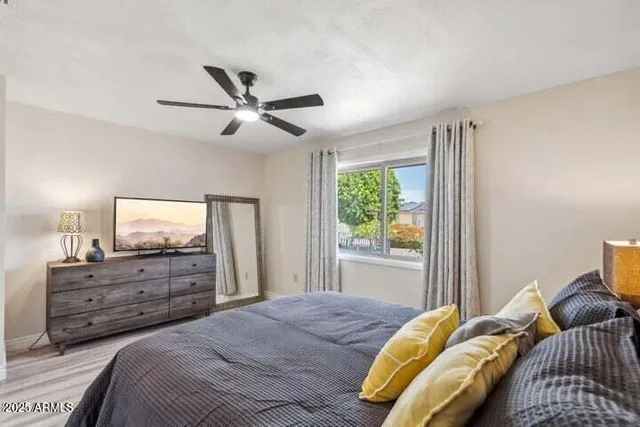 a bedroom with a bed and a dresser