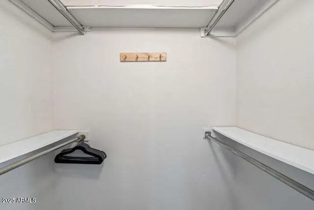 a close view of a utility room with dryer and washer