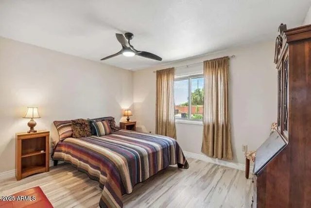 a bedroom with a bed and a window