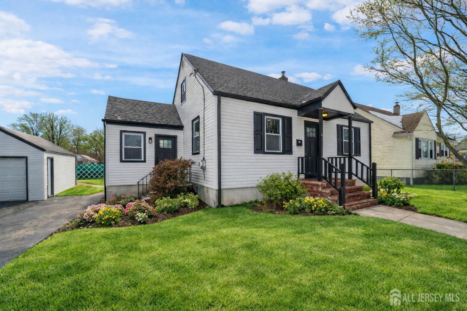 35 Murray Avenue Piscataway, NJ 08854 - Photo 1 of 1 a front view of a house with a garden