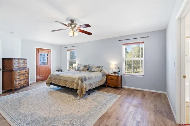 a bathroom with a double vanity sink mirror and toilet