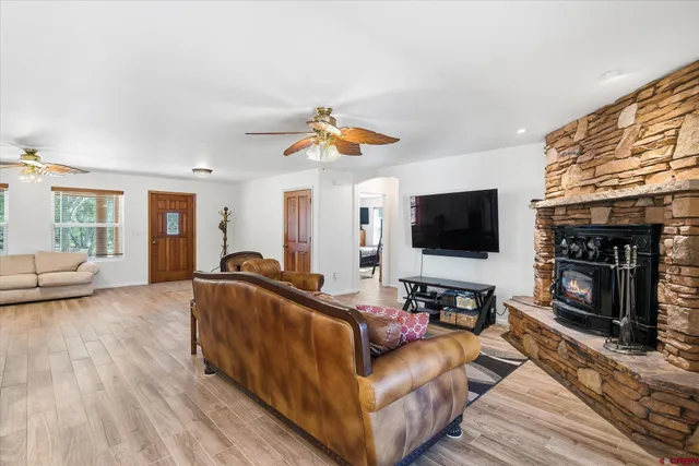 a kitchen with stainless steel appliances granite countertop a sink table and chairs