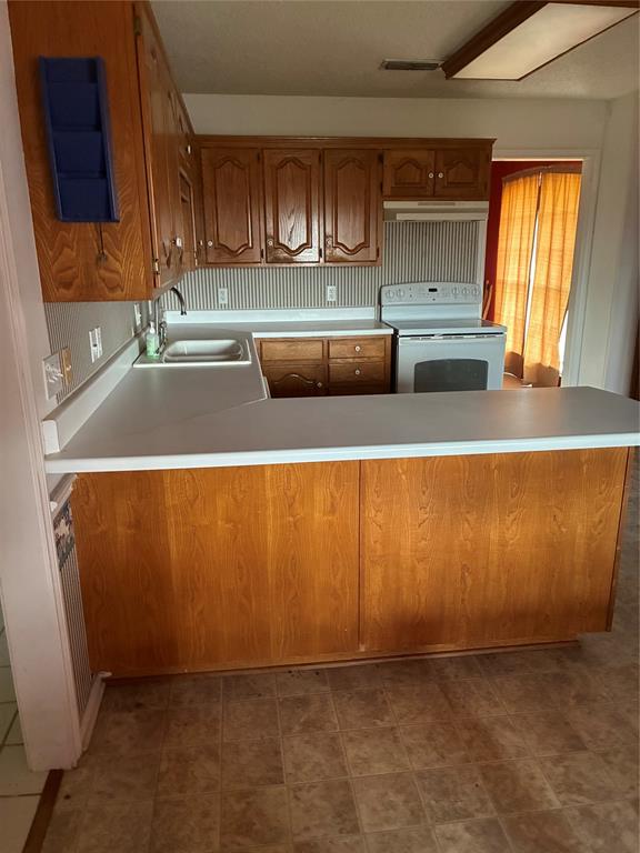 5335 Highway 11 Commerce, TX 75428 - Photo 13 of 16 a view of kitchen with wooden floor and cabinets