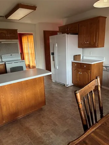 a view of a kitchen with furniture and a window