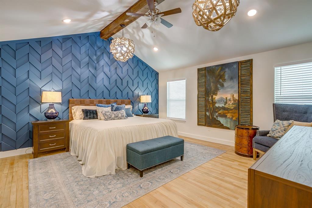 508 South Elm Street Weatherford, TX 76086 - Photo 17 of 40 a bedroom with a bed and wooden floor