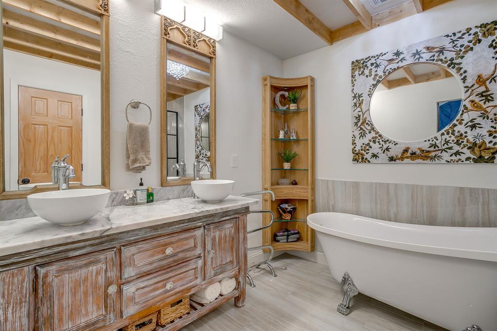 508 South Elm Street Weatherford, TX 76086 - Photo 21 of 40 a bathroom with a granite countertop sink mirror and toilet