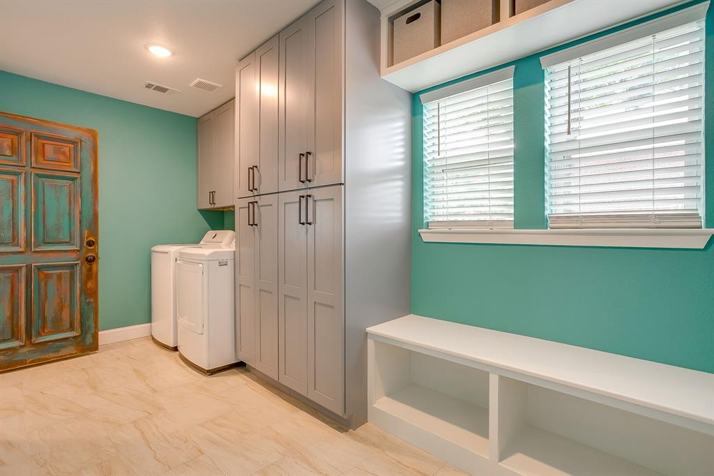 508 South Elm Street Weatherford, TX 76086 - Photo 29 of 40 a view of a kitchen with white cabinets and entryway