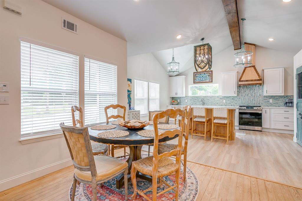 508 South Elm Street Weatherford, TX 76086 - Photo 4 of 40 a dining room with furniture and wooden floor