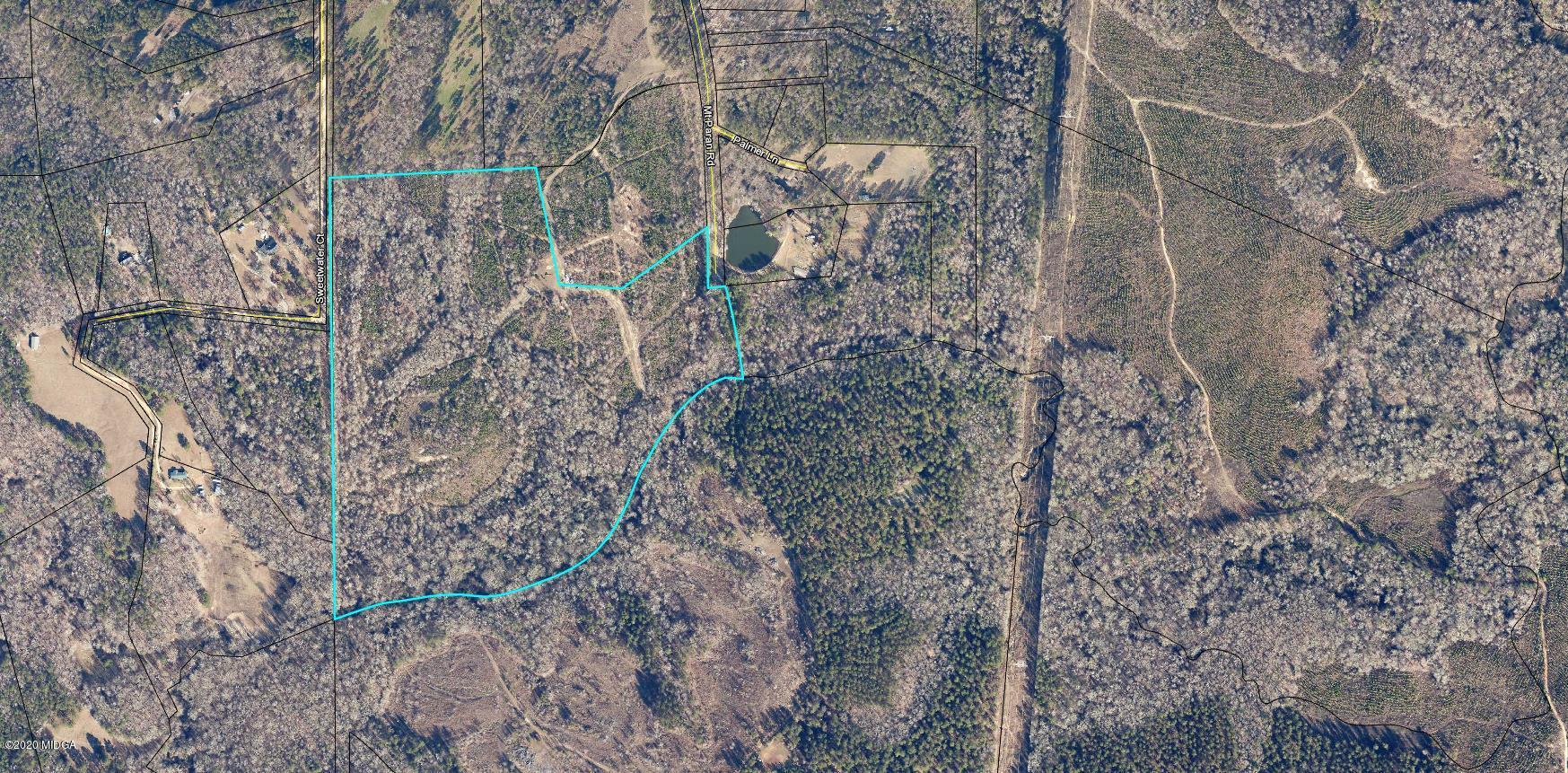 1160 Mt Paran Road Lizella, GA 31052 - Photo 1 of 1 a aerial view of a house with lots of trees