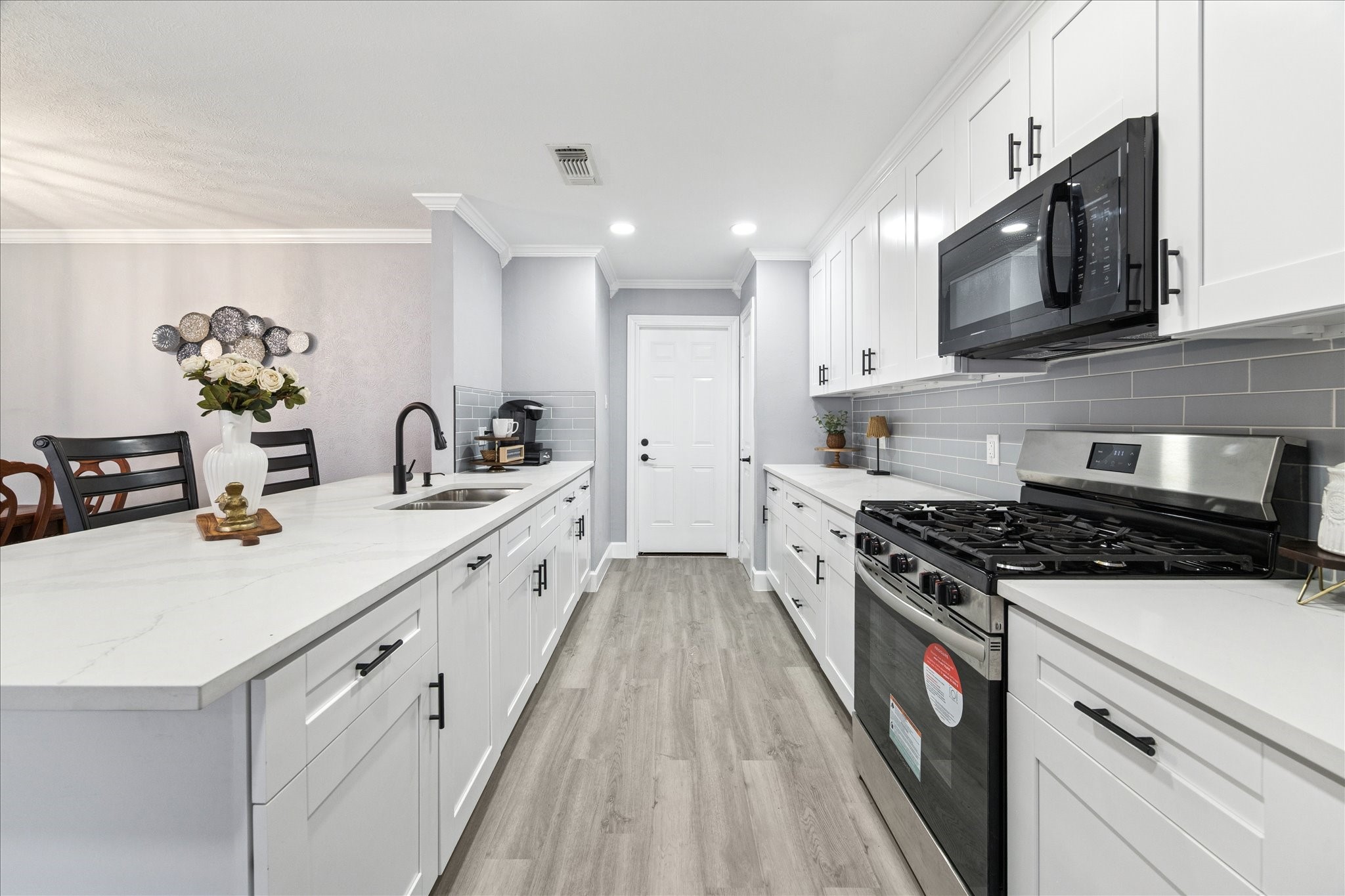 143 Mill Stream Lane Houston, TX 77060 - Photo 1 of 20 a kitchen with stainless steel appliances a sink dishwasher stove microwave and cabinets