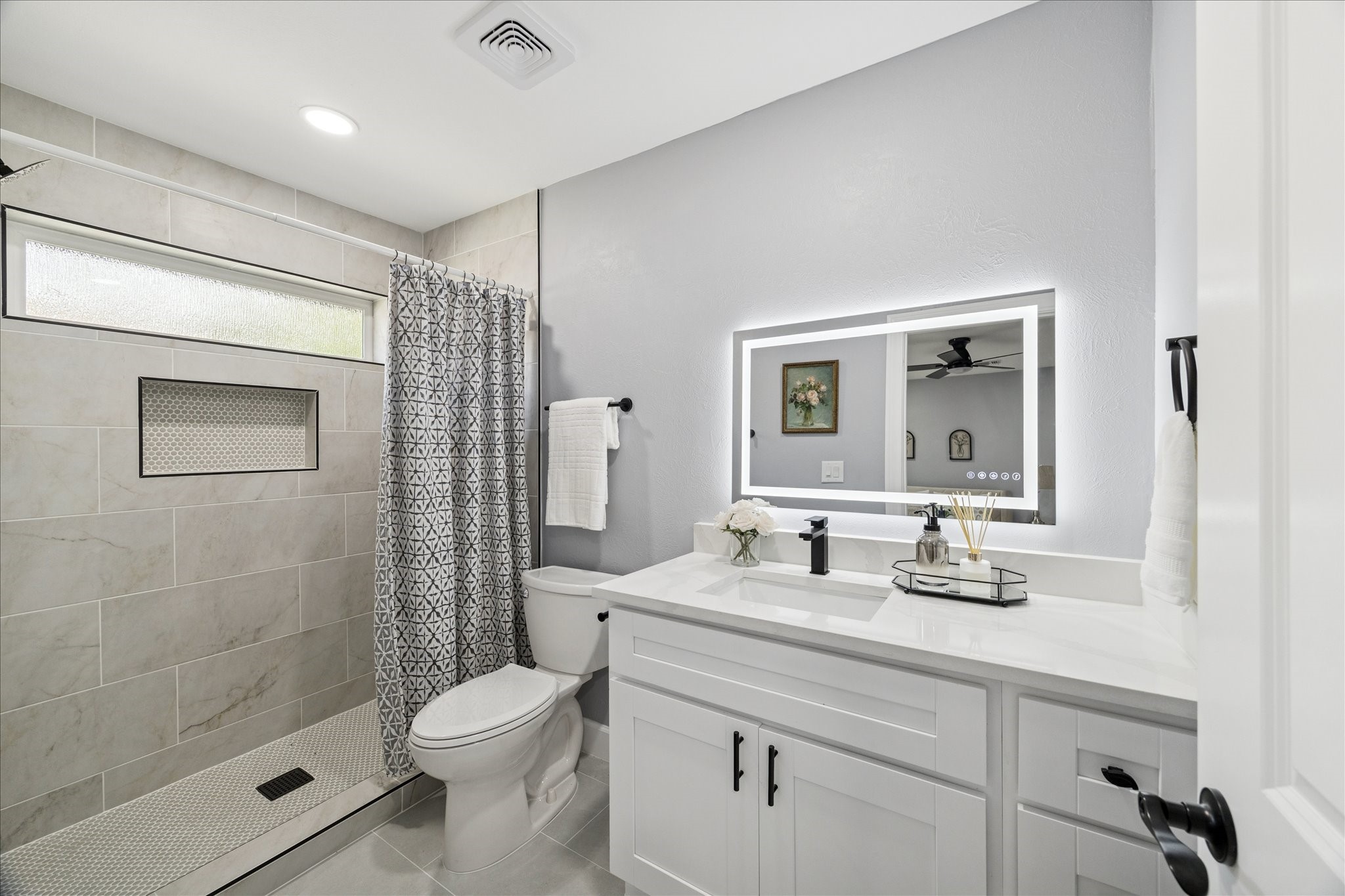 143 Mill Stream Lane Houston, TX 77060 - Photo 14 of 20 a bathroom with a sink a toilet and shower