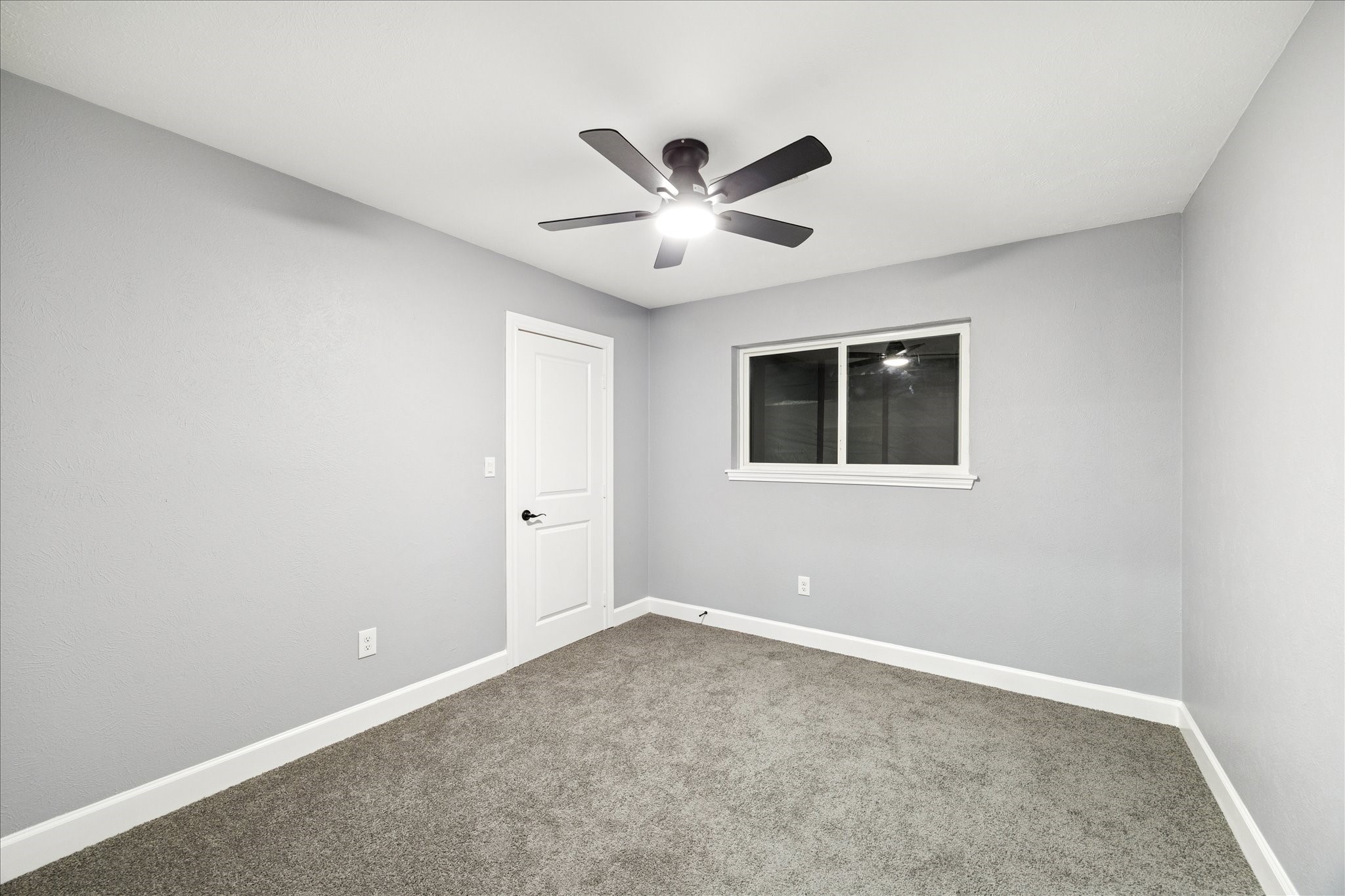 143 Mill Stream Lane Houston, TX 77060 - Photo 16 of 20 a view of an empty room with a ceiling fan