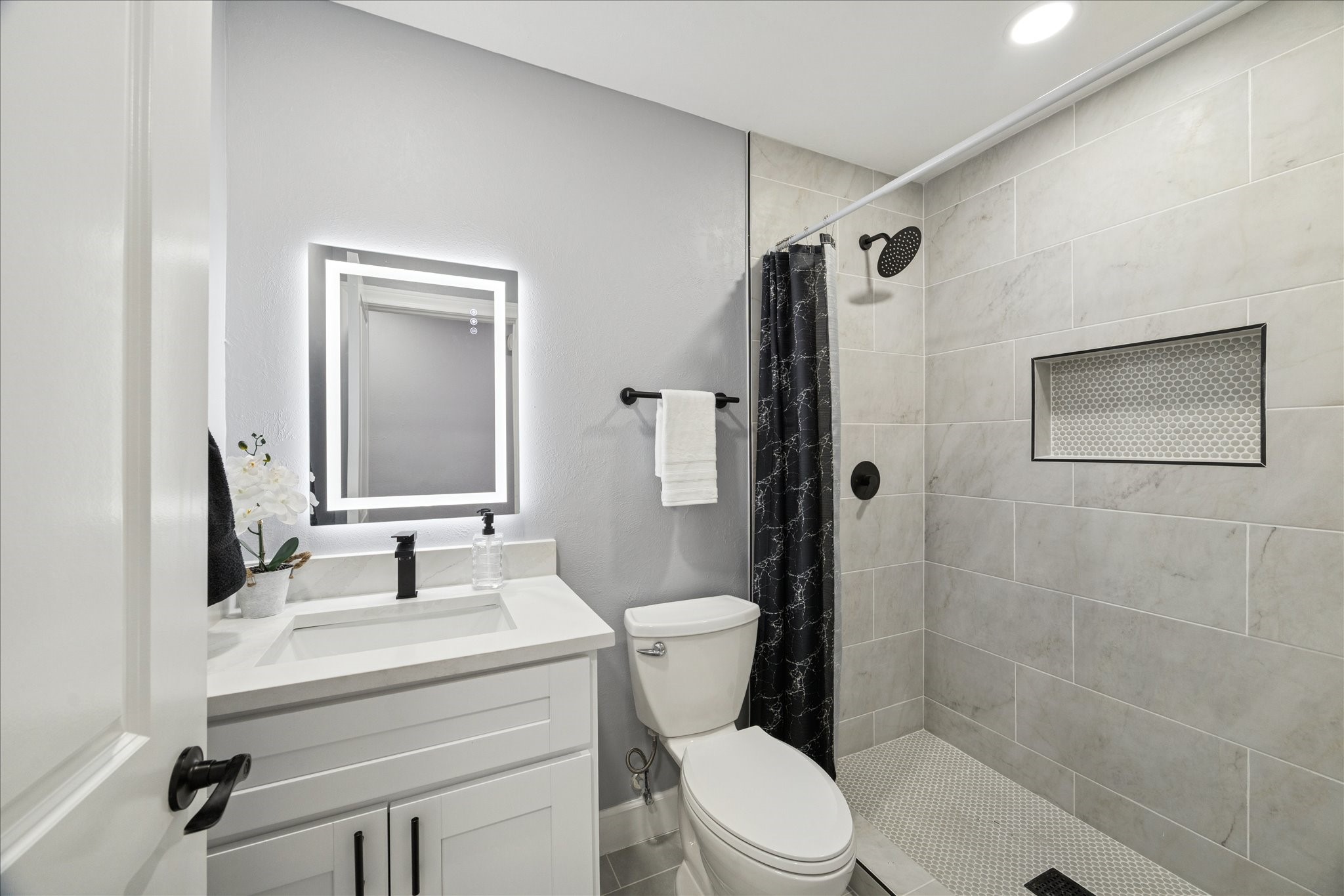 143 Mill Stream Lane Houston, TX 77060 - Photo 17 of 20 a bathroom with a sink toilet and shower