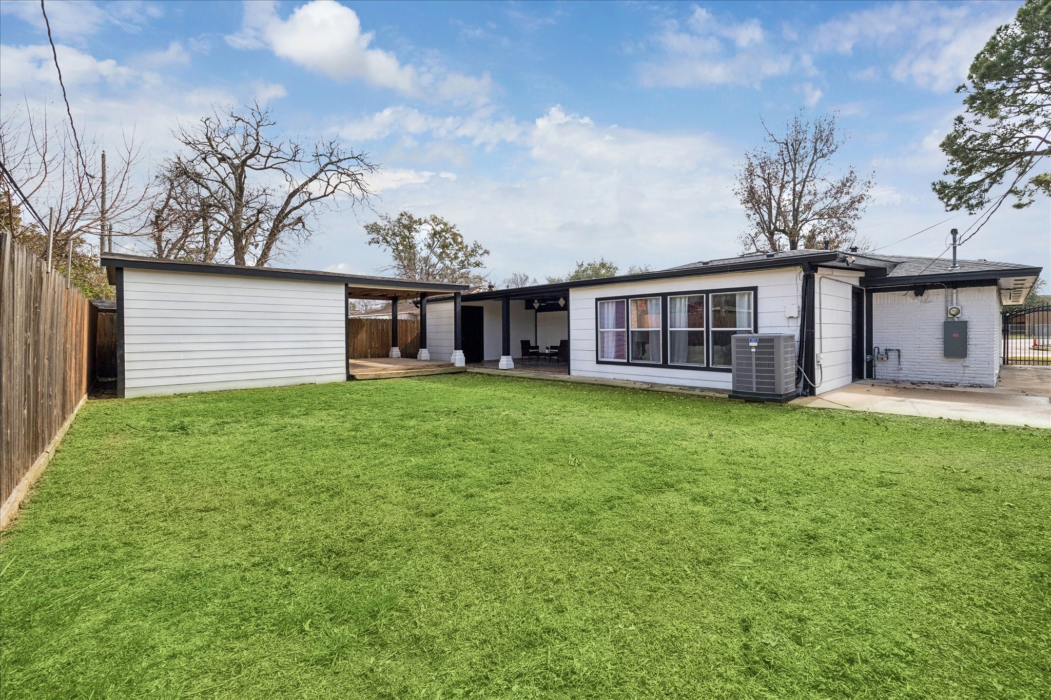 143 Mill Stream Lane Houston, TX 77060 - Photo 5 of 20 a view of a house with a big yard and large trees