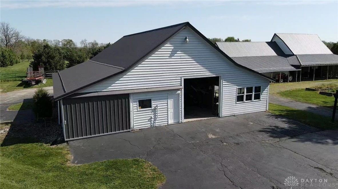 3489 Harlan-Carroll Road Waynesville, OH 45068 - Photo 89 of 98 This spacious barn features a durable metal roof, providing ample storage and utility for various needs.