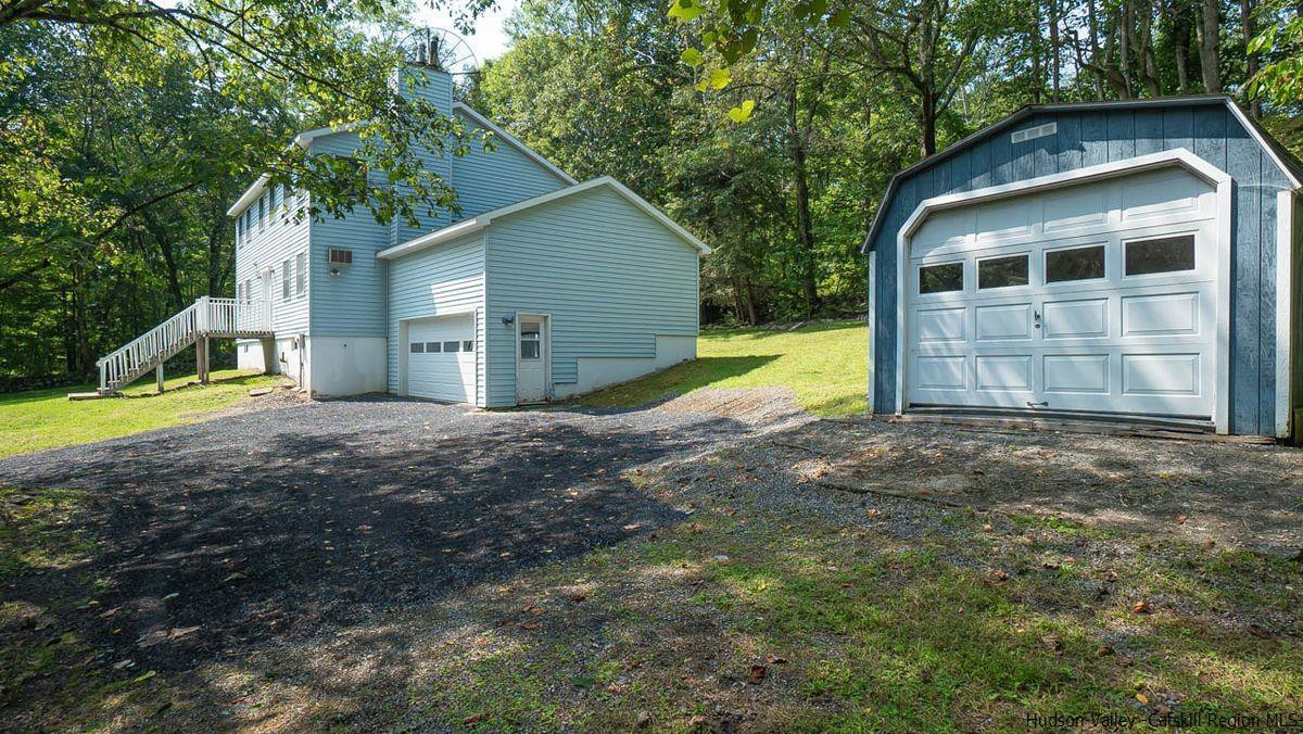 520 Plutarch Road New Paltz, NY 12561 - Photo 23 of 28 a view of a house with backyard and trees