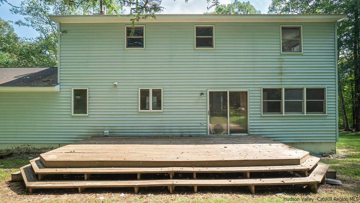 520 Plutarch Road New Paltz, NY 12561 - Photo 25 of 28 a front view of a house with a garage