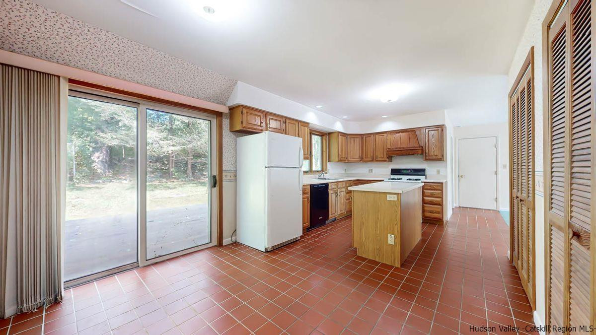 520 Plutarch Road New Paltz, NY 12561 - Photo 7 of 28 a kitchen with stainless steel appliances granite countertop a refrigerator and a sink