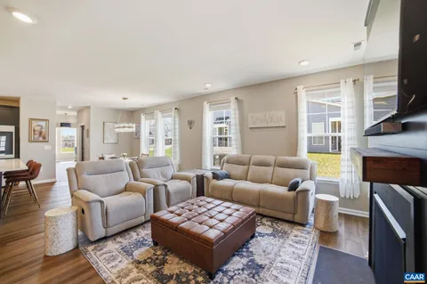 a living room with furniture couches and a fireplace