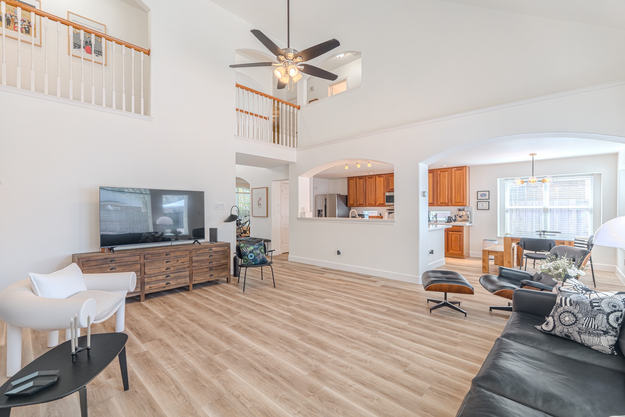 1107 Compass Cove Circle Spring, TX 77379 - Photo 14 of 42 a living room with furniture and a wooden floor