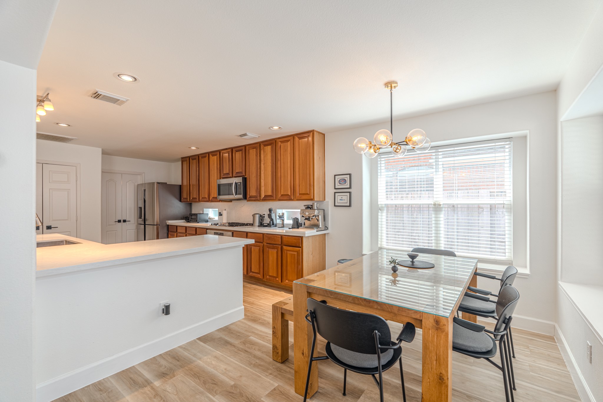 1107 Compass Cove Circle Spring, TX 77379 - Photo 20 of 42 a kitchen with stainless steel appliances kitchen island granite countertop a sink and cabinets