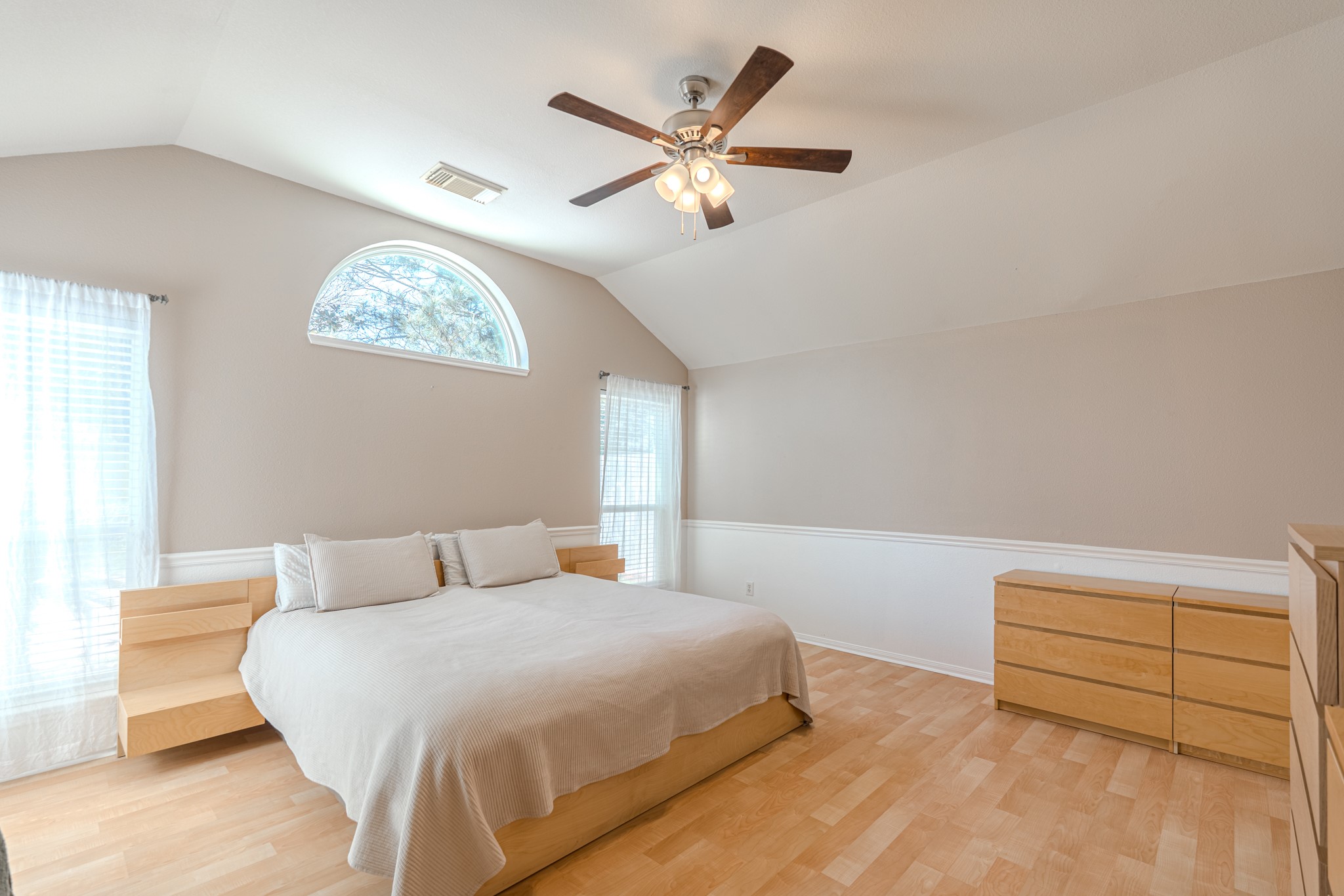 1107 Compass Cove Circle Spring, TX 77379 - Photo 21 of 42 a bedroom with a bed and a chandelier