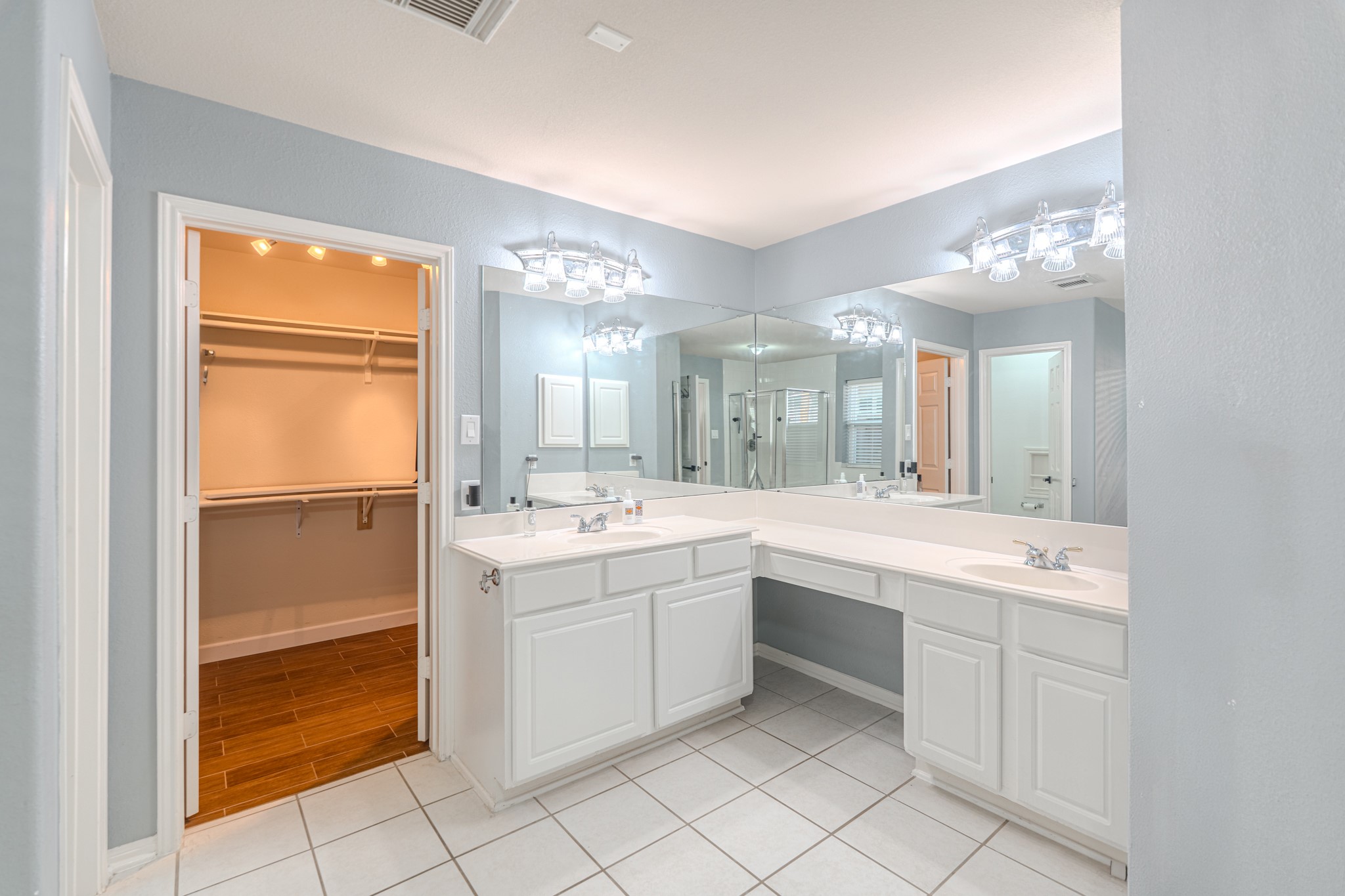 1107 Compass Cove Circle Spring, TX 77379 - Photo 24 of 42 a large bathroom with a double vanity sink mirror and