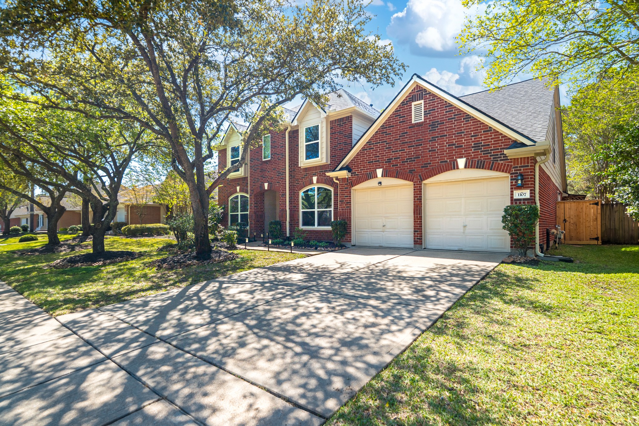 1107 Compass Cove Circle Spring, TX 77379 - Photo 3 of 42 a front view of a house with a yard and garage