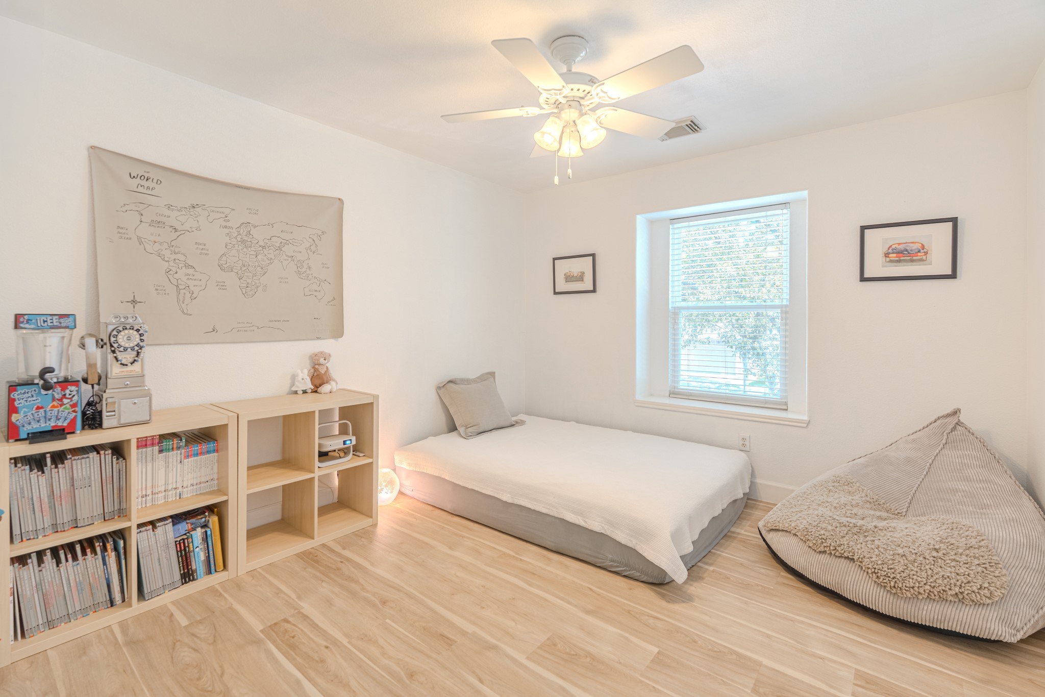 1107 Compass Cove Circle Spring, TX 77379 - Photo 32 of 42 a bedroom with a bed and a book shelf