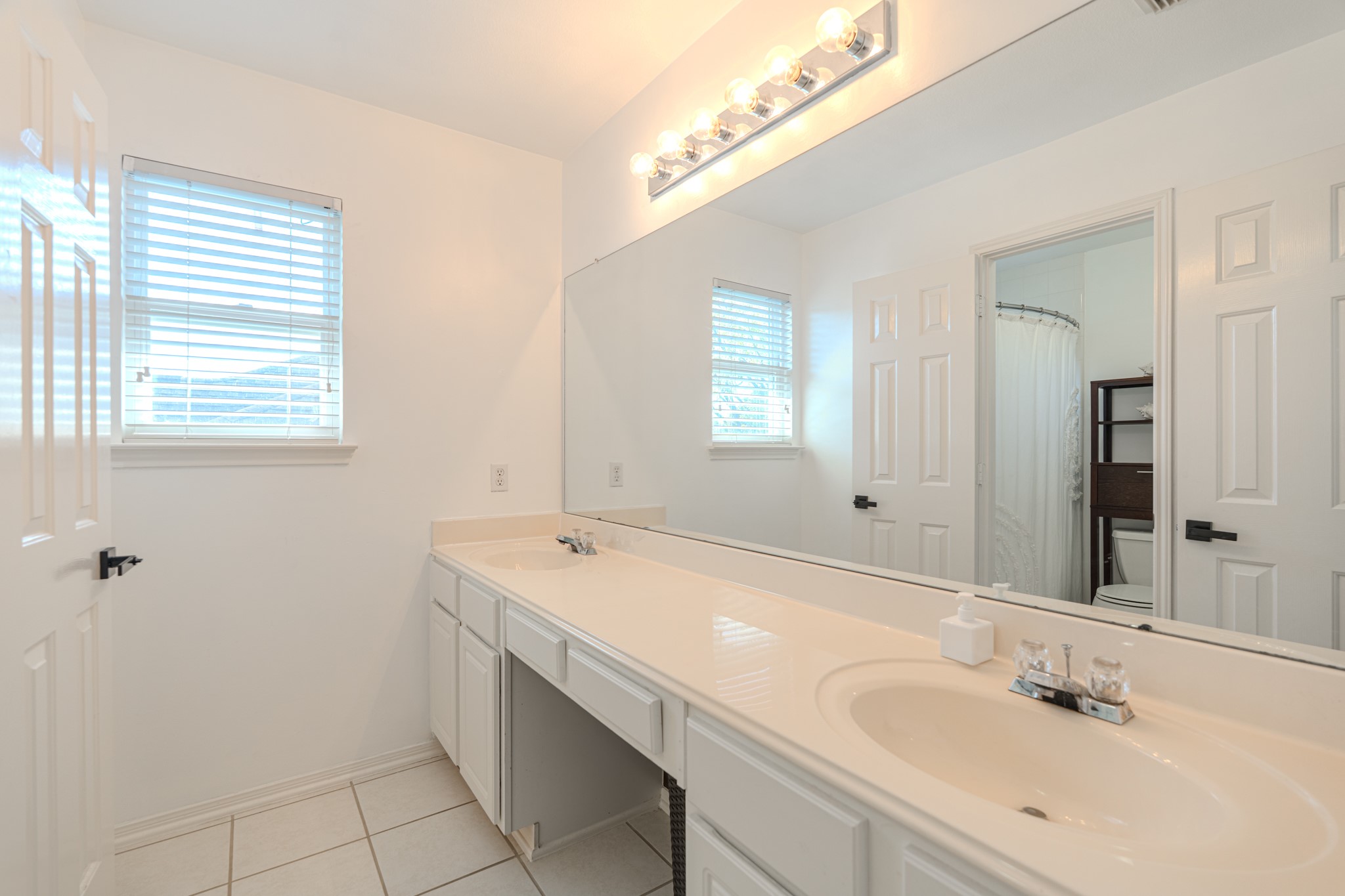 1107 Compass Cove Circle Spring, TX 77379 - Photo 36 of 42 a bathroom with a sink and a mirror