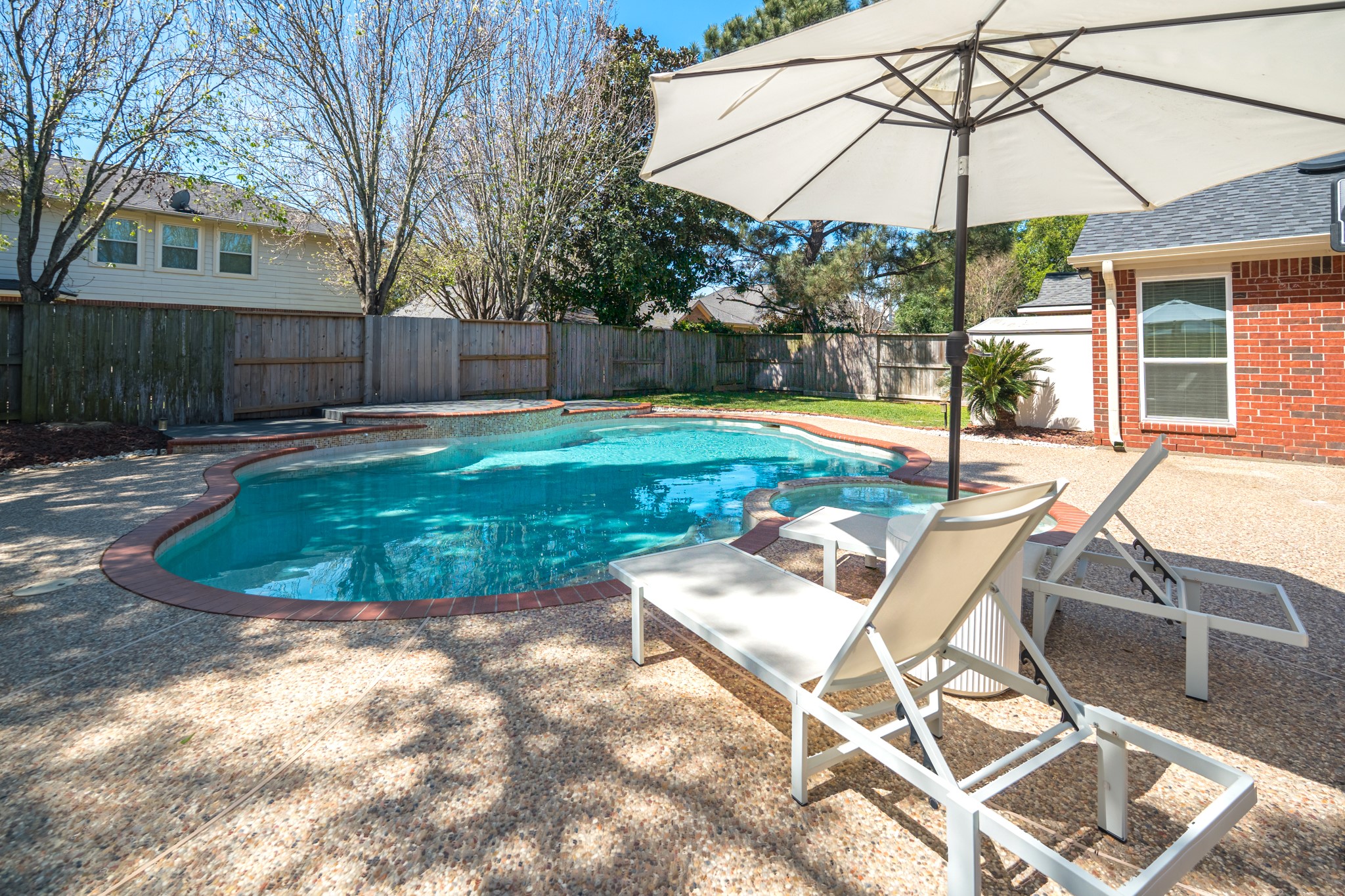 1107 Compass Cove Circle Spring, TX 77379 - Photo 41 of 42 a view of a chair and table in the backyard