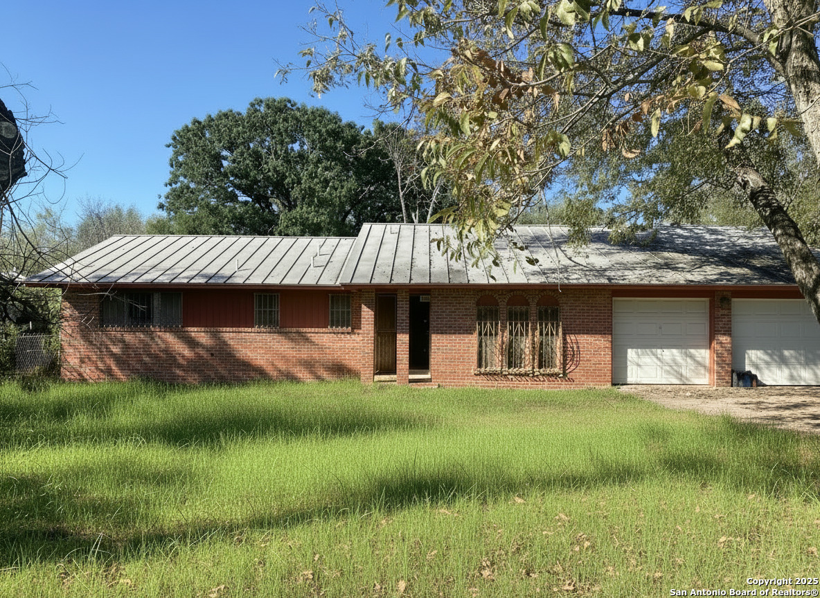 a view of a wooden deck and a yard