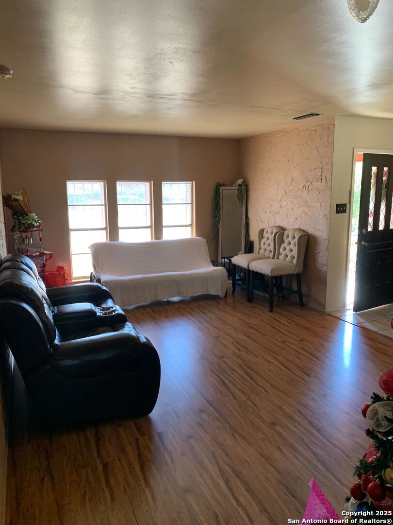 127 Roesler Road San Antonio, TX 78220 - Photo 11 of 17 a living room with furniture and a wooden floor