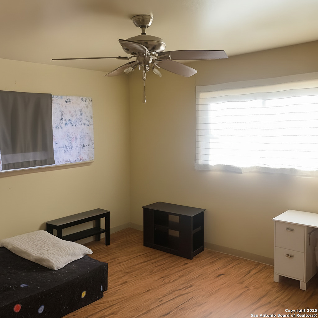127 Roesler Road San Antonio, TX 78220 - Photo 12 of 17 a view of a room with wooden floor and windows