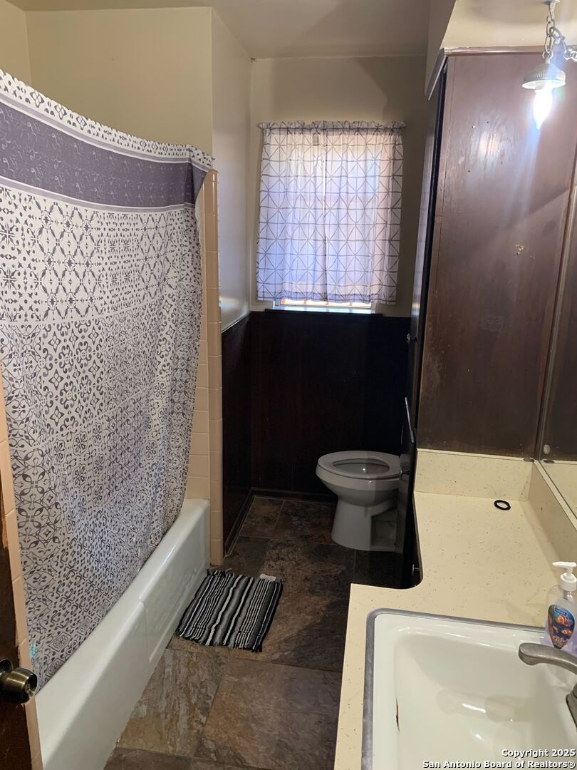 127 Roesler Road San Antonio, TX 78220 - Photo 13 of 17 a bathroom with a toilet and a shower