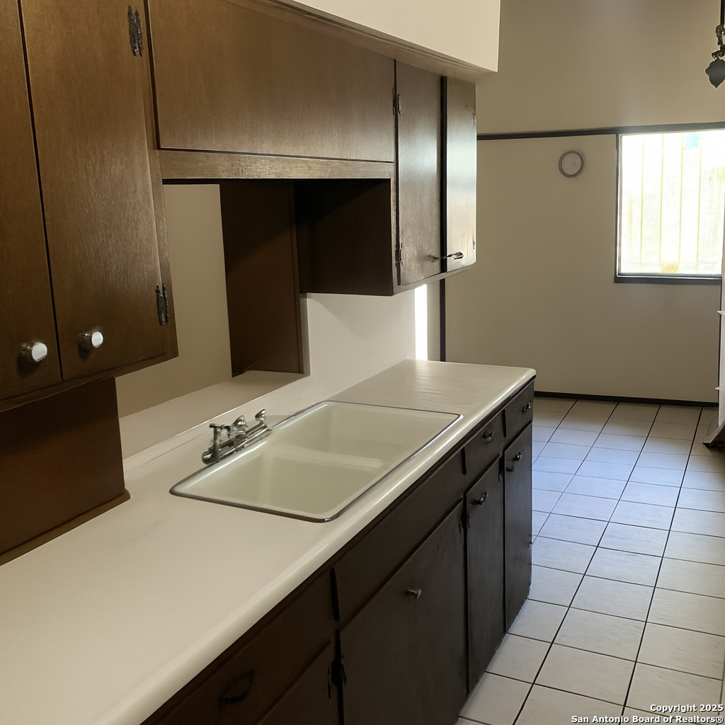 127 Roesler Road San Antonio, TX 78220 - Photo 7 of 17 a bathroom with a sink a vanity and a mirror