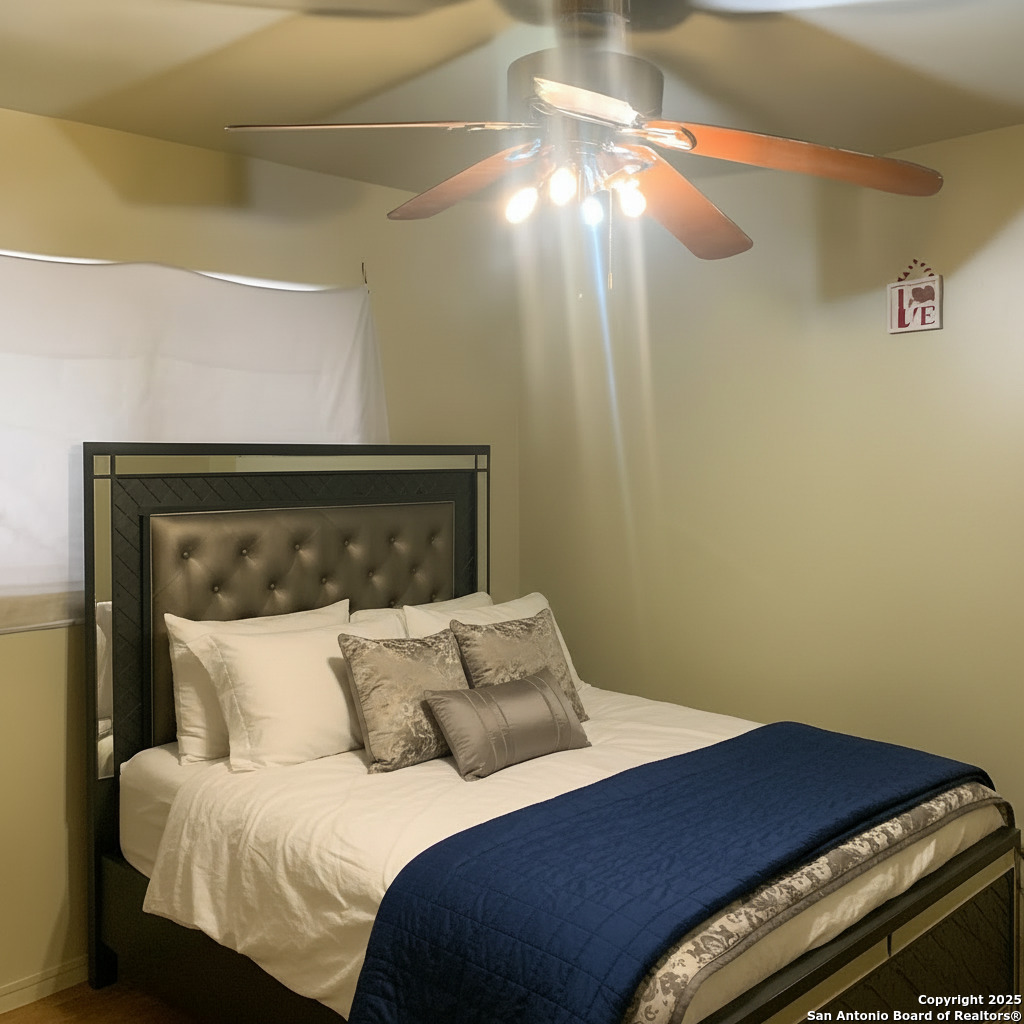 127 Roesler Road San Antonio, TX 78220 - Photo 10 of 17 a bedroom with a bed and a mirror